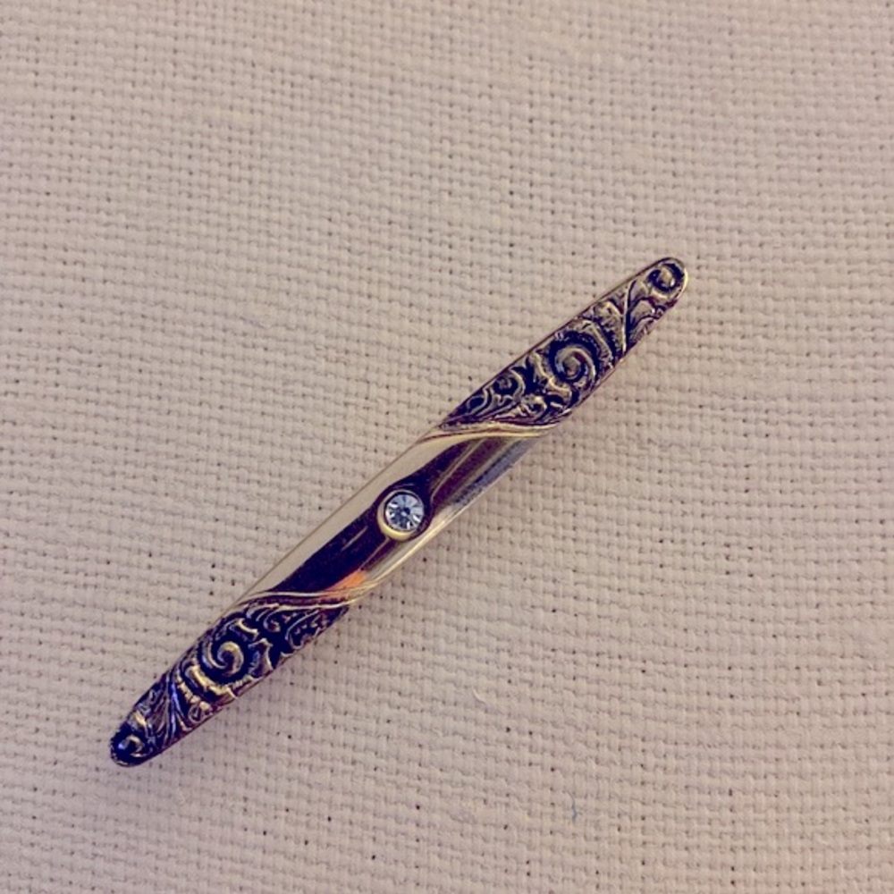 Vintage AVON gold tone oval bar pin, baroque scroll details & centre stone